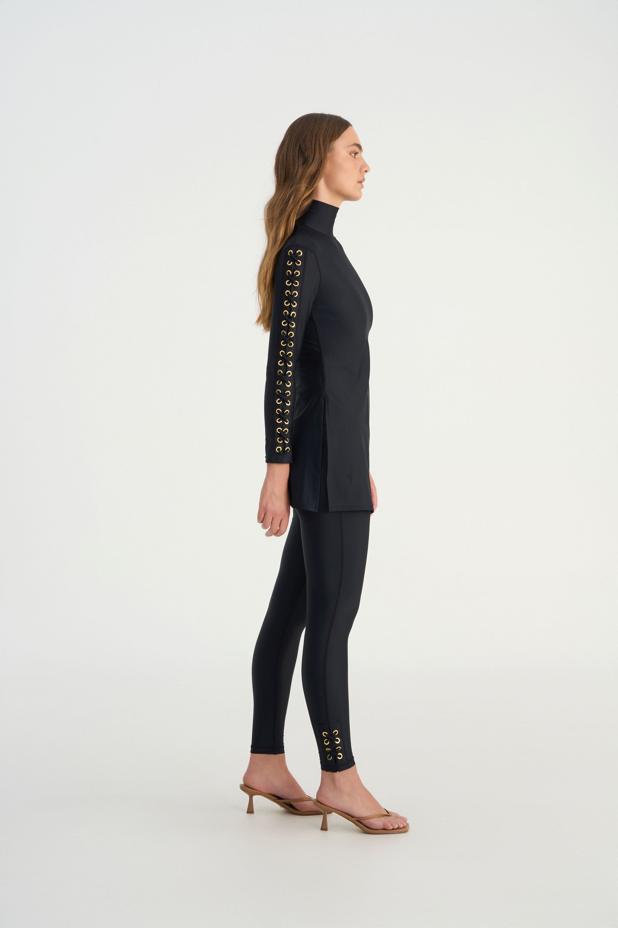Hand-finished eyelet detailing on the sleeve of the JAMILA luxury swim tunic